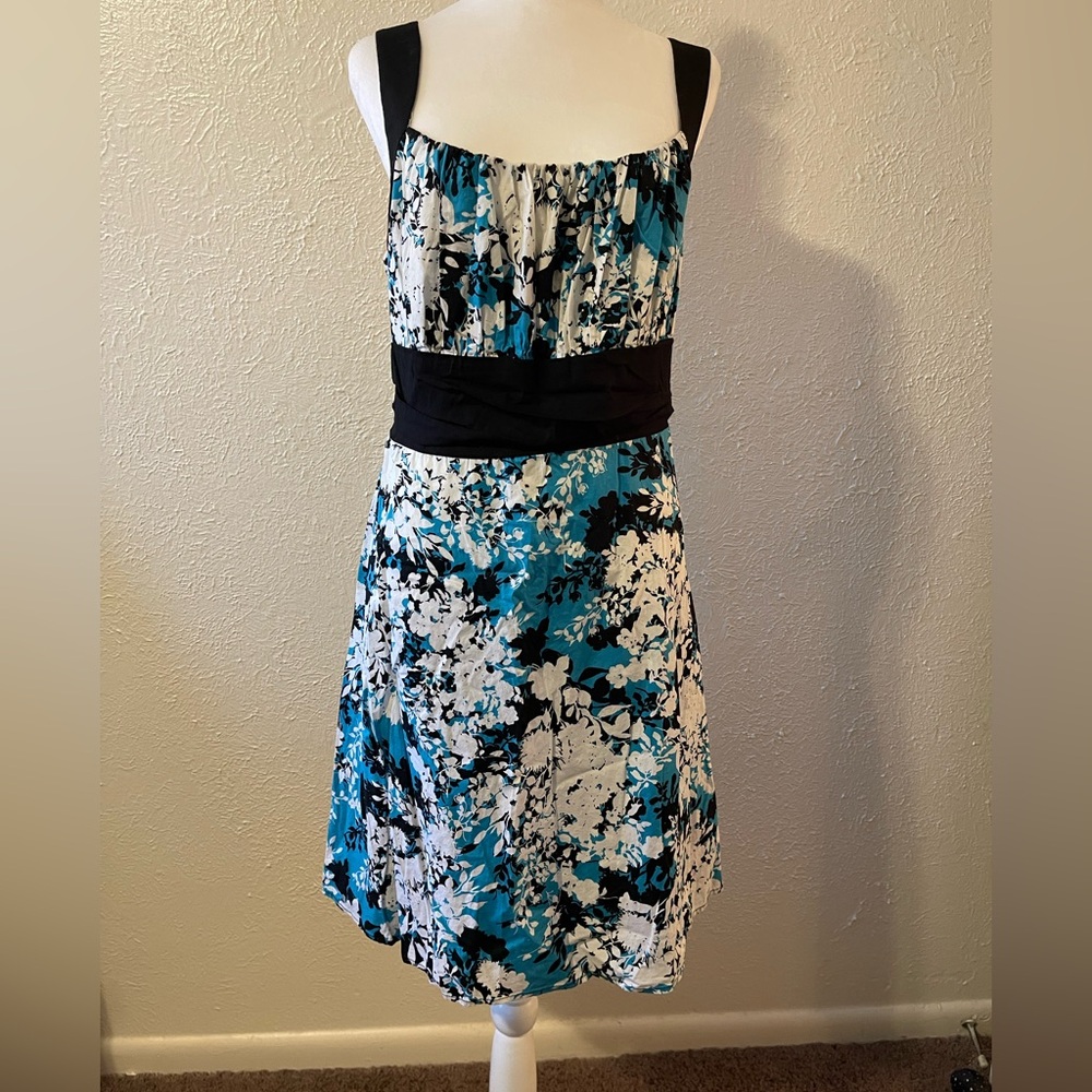 B. Smart Floral Sleeveless Dress with Black Accents
